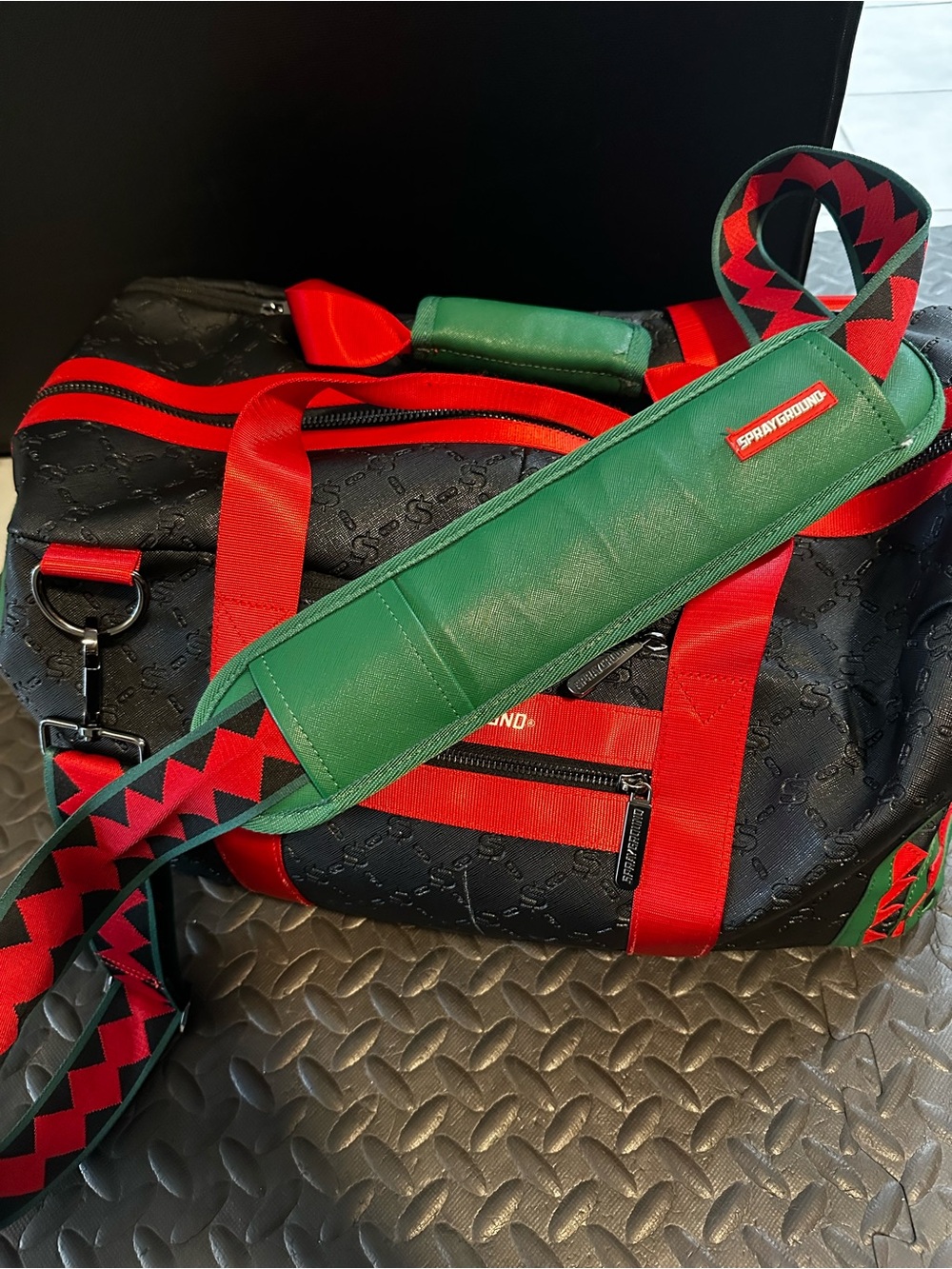 Sprayground Black Duffel with Green Shoulder Pad and Red Accents